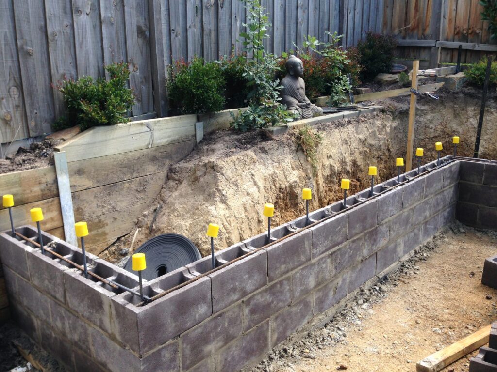 Block retaining wall construction in Croydon by InEx Lifestyle Design landscapers