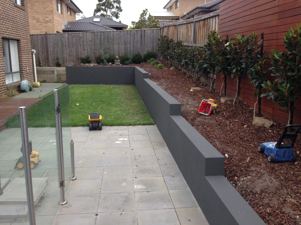 Block retaining wall in Croydon by InEx Lifestyle Design landscapers