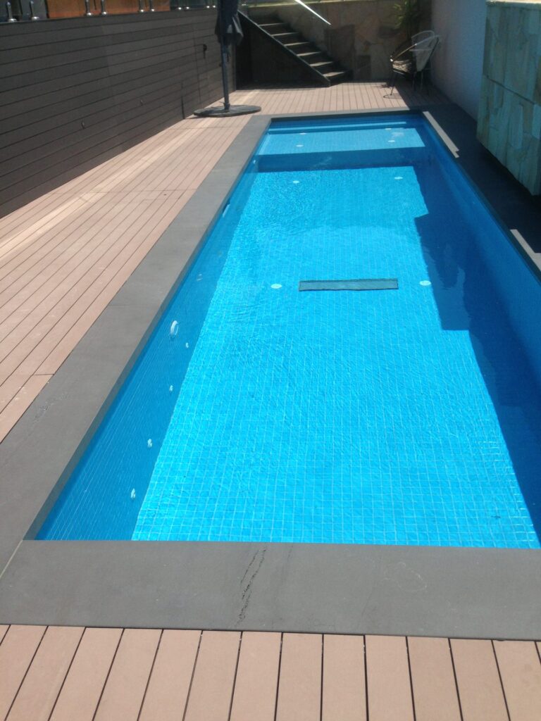 Composite deck lap pool in Wheelers Hill by InEx Lifestyle Design landscapers