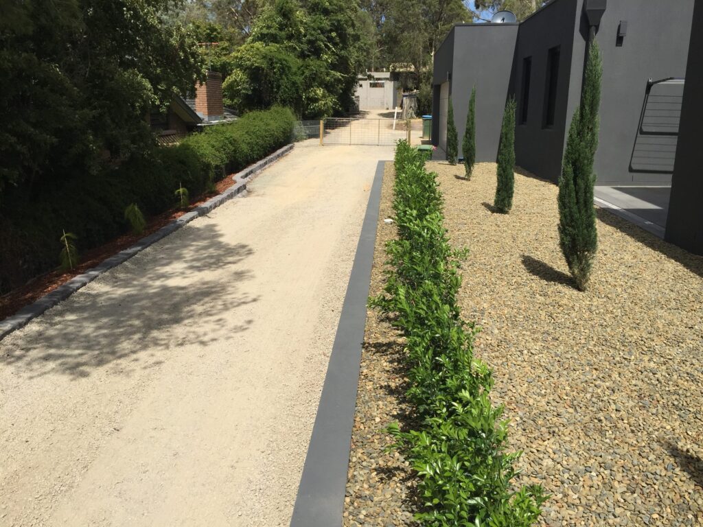 Gravel driveway hedging in Park Orchards by InEx Lifestyle Design landscapers