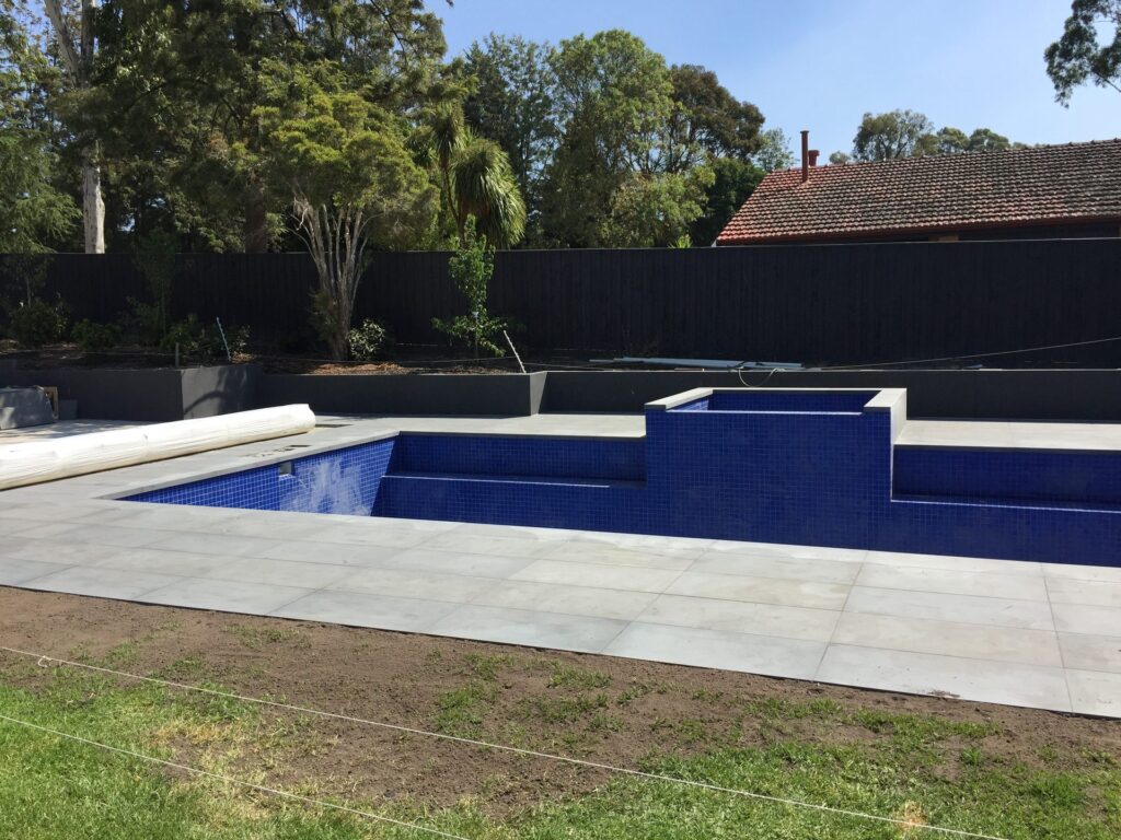 Pool surround paving in Park Orchards by InEx Lifestyle Design landscapers