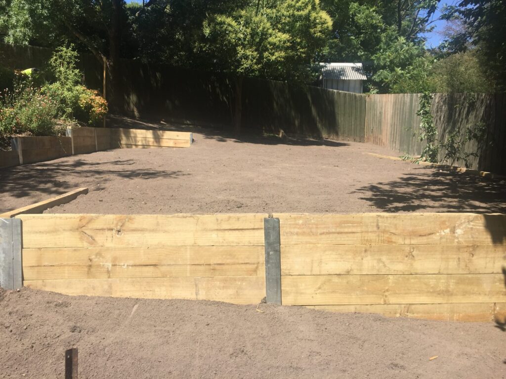 Sleeper retaining wall in Eltham by InEx Lifestyle Design landscapers