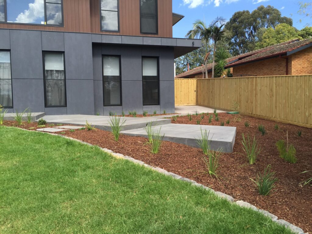 Stone edged garden beds in Park Orchards by InEx Lifestyle Design landscapers