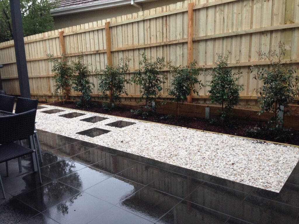 Tiled courtyard pebble in Glen Iris by InEx Lifestyle Design landscapers