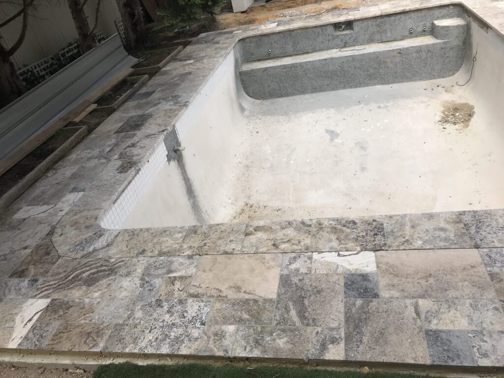 Travertine pool coping in Brighton by InEx Lifestyle Design landscapers