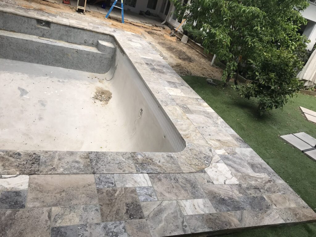 Travertine pool coping in Brighton by InEx Lifestyle Design landscapers